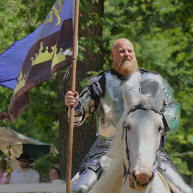 Sir Edward holds his flag in the Knights of the New Order at the Magical Realm Fantasy Faire in Michigan.