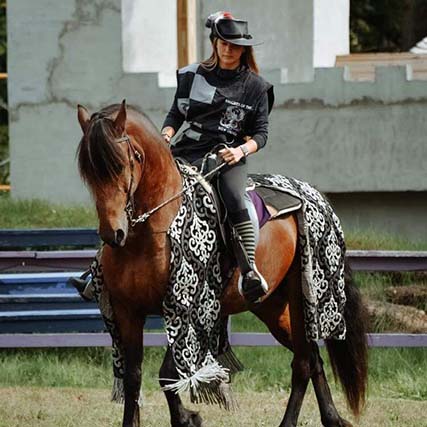 Lady Luna is one of the squires who helps out at the joust with the Knights of the New Order